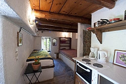 kitchen, double and single bed.